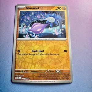 glimmet [reverse holo] - 114/191 (common) — pokemon: surging sparks